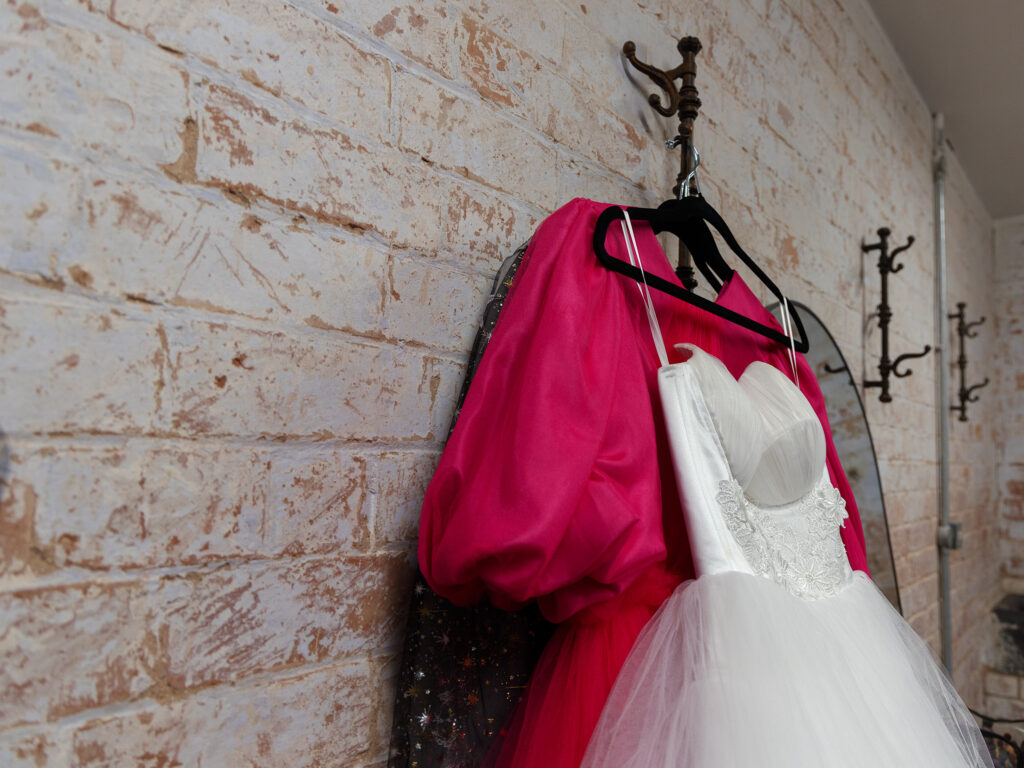 Elegant banner featuring a beautiful pink and white wedding dress adorned with intricate lace details and delicate floral accents, perfect for a romantic wedding ceremony